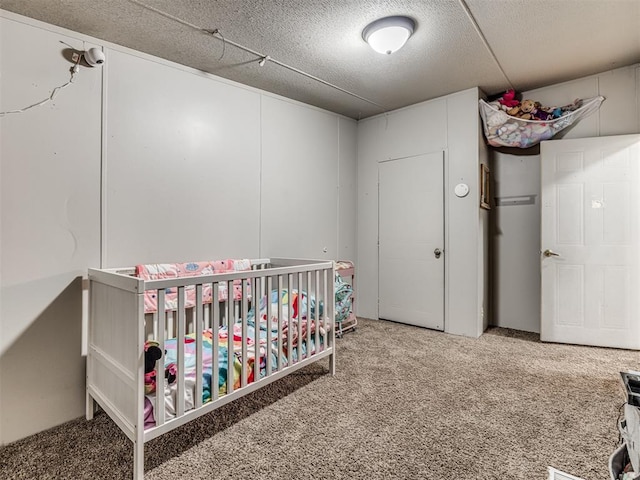 14417 Longhorn Dr, Jones, OK 73049 - bedroom with carpet, a crib, and a textured ceiling