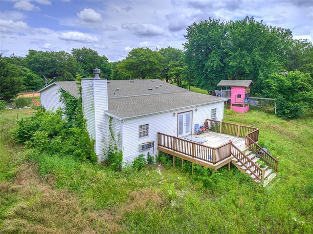 14417 Longhorn Dr, Jones, OK 73049 - rear view of property featuring a wooden deck, a chimney, an outdoor structure, french doors, and roof with shingles
