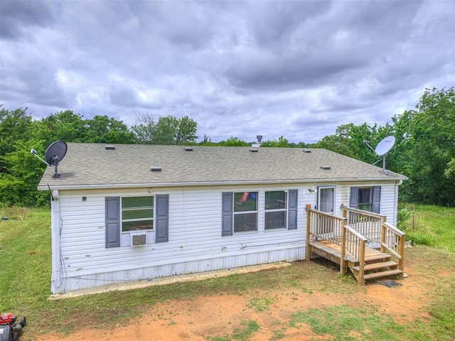 14417 Longhorn Dr, Jones, OK 73049 - rear view of house featuring a shingled roof, cooling unit, a deck, and a lawn