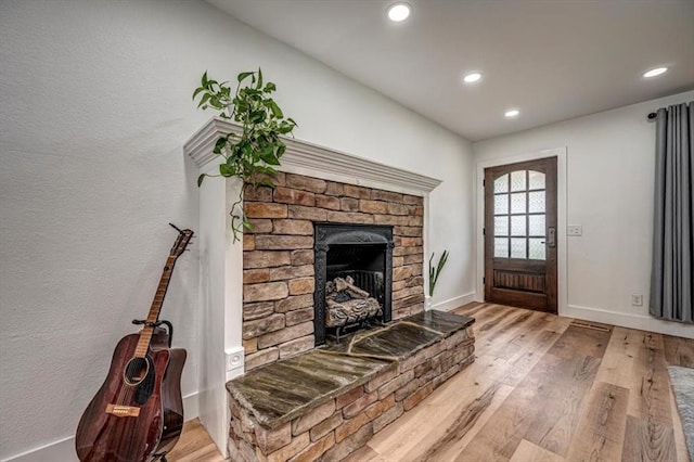2401 Davis Rd, Guthrie, OK 73044 - living area with recessed lighting, wood finished floors, a fireplace, and baseboards