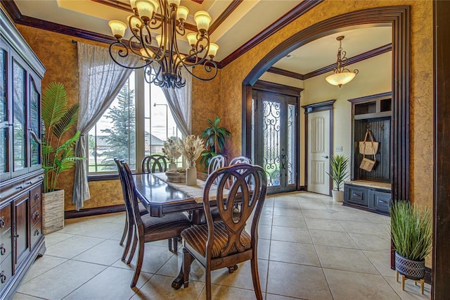 14220 SE 76th Pl, Oklahoma City, OK 73150 - dining space featuring ornamental molding, arched walkways, a chandelier, and light tile patterned floors