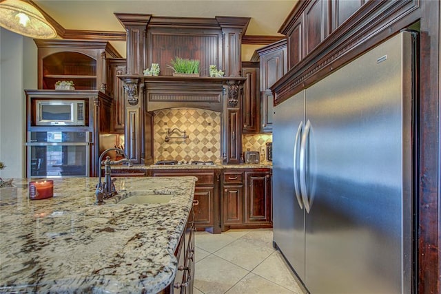14220 SE 76th Pl, Oklahoma City, OK 73150 - kitchen featuring stainless steel appliances, a sink, tasteful backsplash, ornamental molding, and light stone countertops