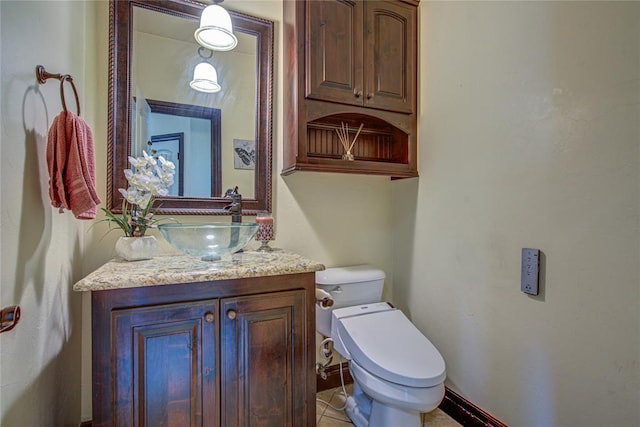 14220 SE 76th Pl, Oklahoma City, OK 73150 - bathroom with vanity, toilet, tile patterned flooring, and baseboards