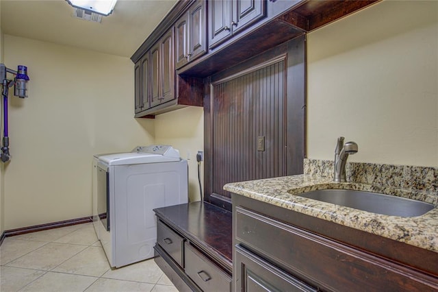 14220 SE 76th Pl, Oklahoma City, OK 73150 - laundry area featuring cabinet space, separate washer and dryer, light tile patterned flooring, and baseboards