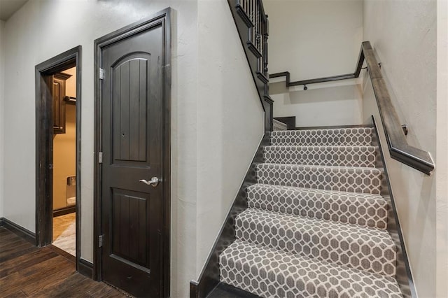 15101 Colonia Bella Dr, Edmond, OK 73013 - stairs featuring wood finished floors and baseboards