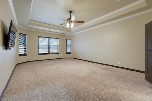 15101 Colonia Bella Dr, Edmond, OK 73013 - empty room with a tray ceiling, light colored carpet, ceiling fan, ornamental molding, and baseboards