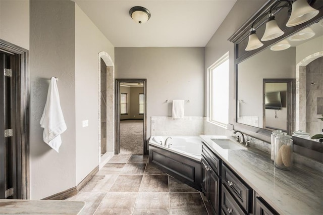 15101 Colonia Bella Dr, Edmond, OK 73013 - bathroom featuring a bath, a tile shower, and vanity