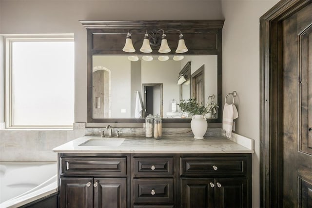 15101 Colonia Bella Dr, Edmond, OK 73013 - full bathroom featuring double vanity and a tub to relax in
