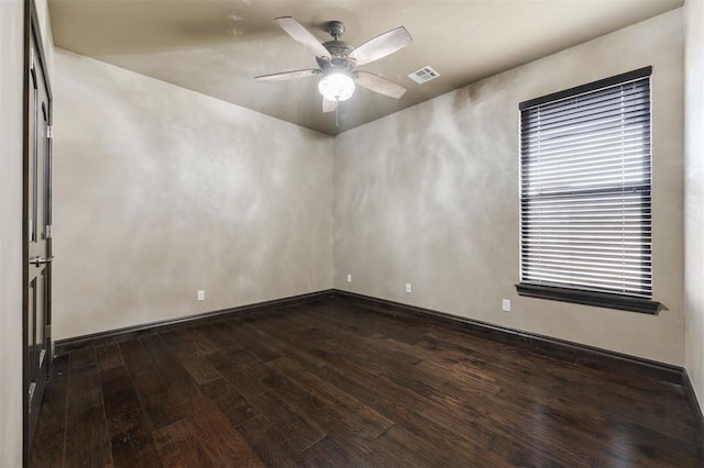 15101 Colonia Bella Dr, Edmond, OK 73013 - empty room with dark wood finished floors, ceiling fan, and baseboards