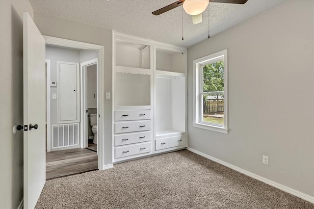 1013 Locust Ln, Midwest City, OK 73110 - unfurnished bedroom featuring carpet floors, a textured ceiling, baseboards, and ceiling fan