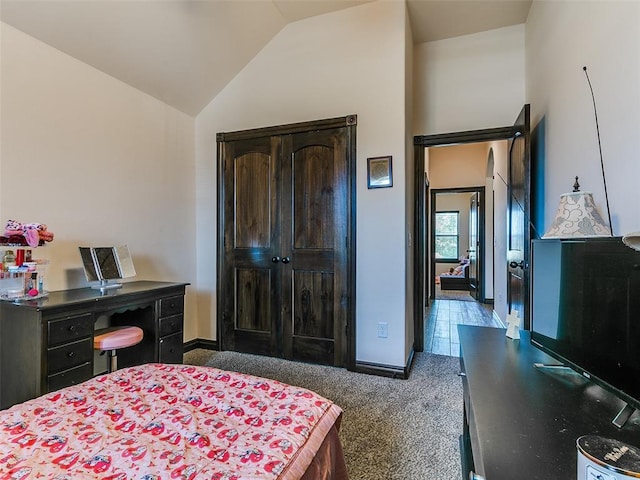 3424 Lakeside Dr, Moore, OK 73160 - bedroom featuring vaulted ceiling, carpet, baseboards, and a closet
