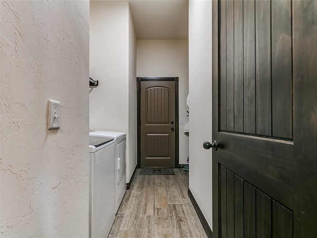 3424 Lakeside Dr, Moore, OK 73160 - laundry area with washer and clothes dryer and wood finished floors