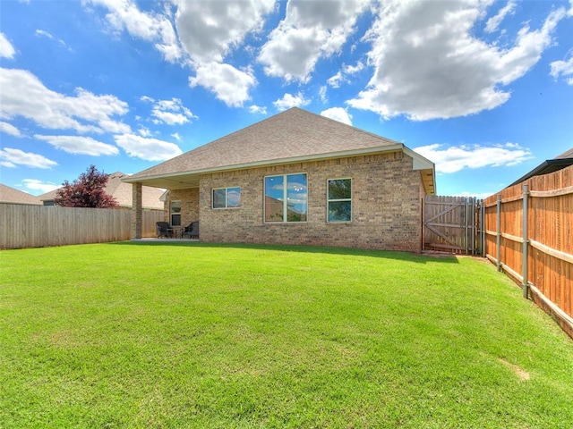 3424 Lakeside Dr, Moore, OK 73160 - rear view of house featuring brick siding, a gate, a patio, and a shingled roof