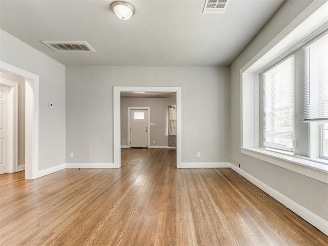 1017 N Broadway Ave, Shawnee, OK 74801 - spare room with plenty of natural light, light wood-type flooring, and baseboards