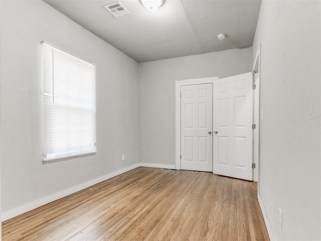 1017 N Broadway Ave, Shawnee, OK 74801 - unfurnished bedroom featuring wood finished floors, baseboards, and a closet