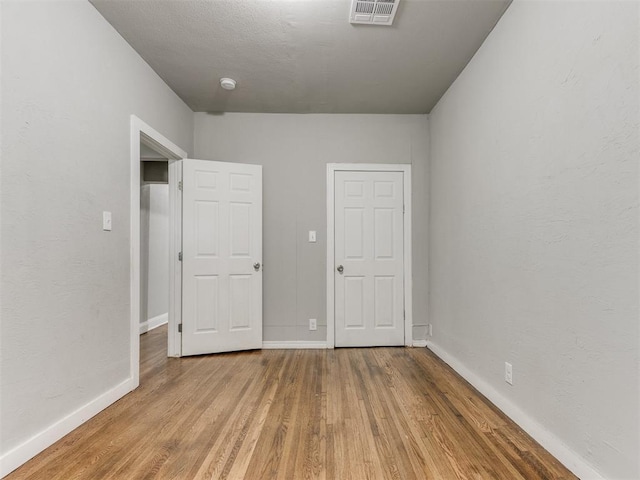 1017 N Broadway Ave, Shawnee, OK 74801 - unfurnished bedroom featuring wood finished floors and baseboards