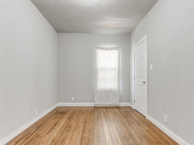 1017 N Broadway Ave, Shawnee, OK 74801 - unfurnished room featuring light wood finished floors and baseboards