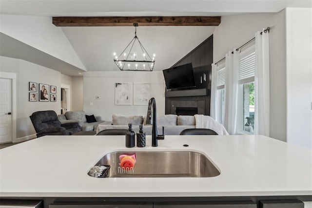 124 W 5th St, Arcadia, OK 73007 - kitchen featuring open floor plan, light countertops, and a chandelier