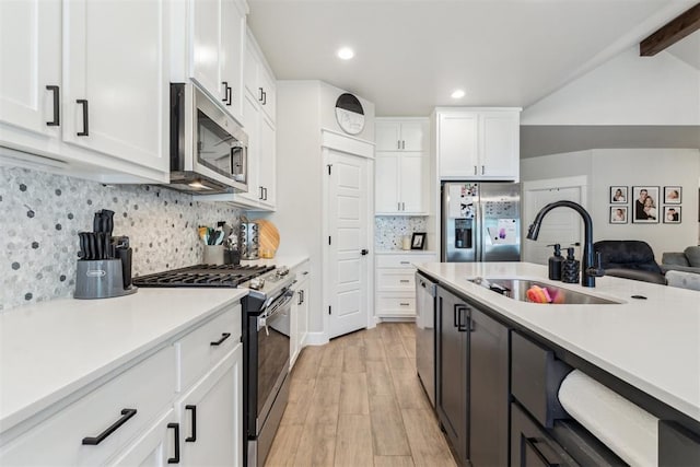 124 W 5th St, Arcadia, OK 73007 - kitchen with stainless steel appliances, light wood-type flooring, light countertops, white cabinetry, and recessed lighting