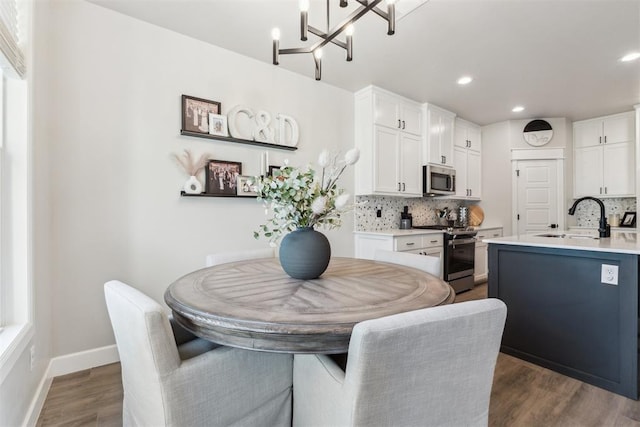 124 W 5th St, Arcadia, OK 73007 - dining area featuring a chandelier, dark wood-style floors, and recessed lighting