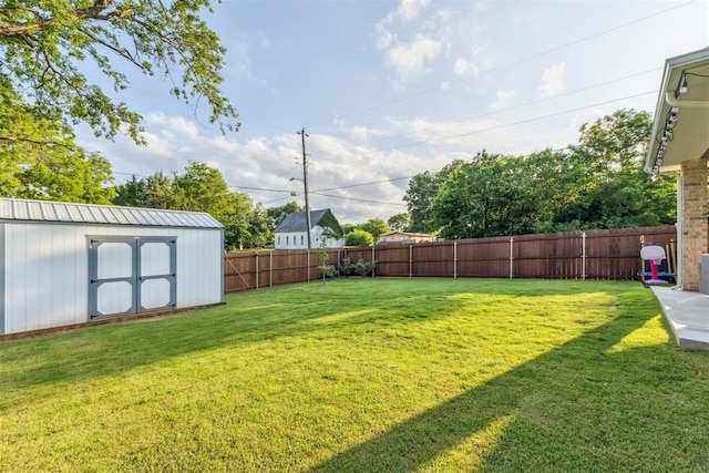 124 W 5th St, Arcadia, OK 73007 - fenced backyard with a storage unit