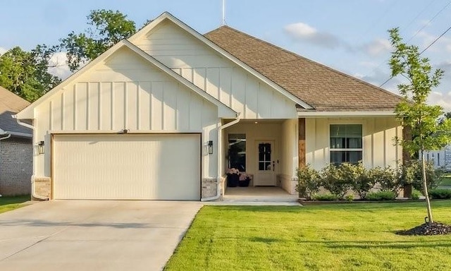 124 W 5th St, Arcadia, OK 73007 - view of front of home featuring board and batten siding, a garage, roof with shingles, driveway, and a front yard