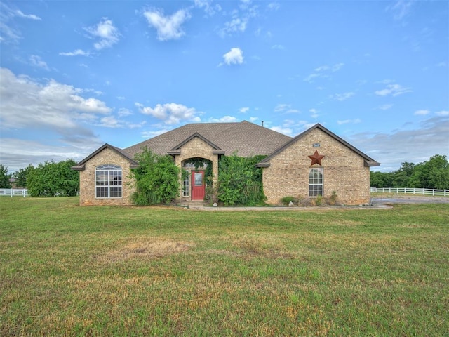 3501 Shell Ln, Yukon, OK 73099 - french country style house with brick siding and roof with shingles