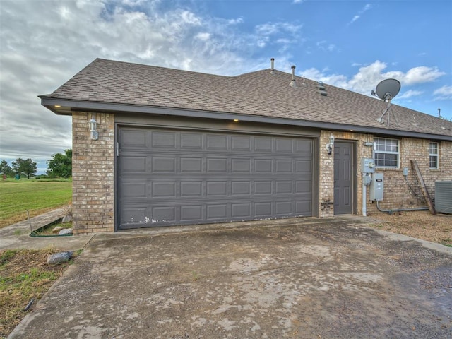 3501 Shell Ln, Yukon, OK 73099 - view of front facade with concrete driveway, brick siding, and roof with shingles