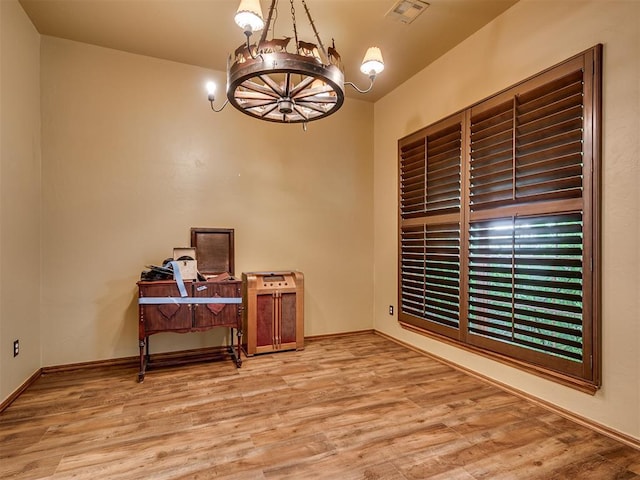 3501 Shell Ln, Yukon, OK 73099 - office space with a chandelier, wood finished floors, and baseboards