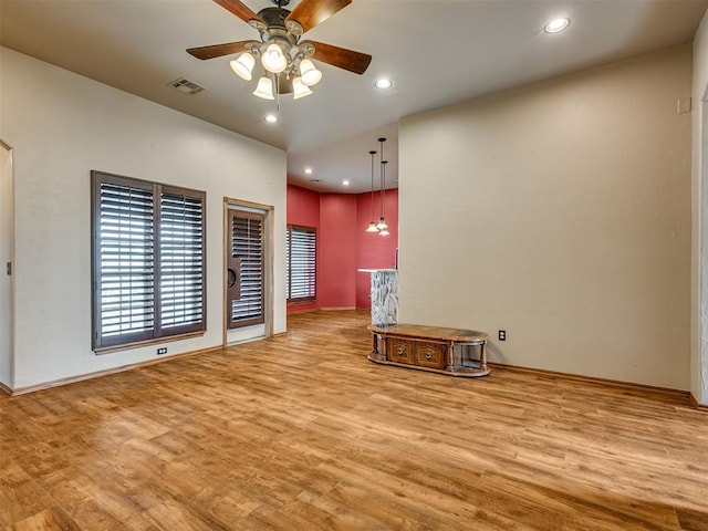 3501 Shell Ln, Yukon, OK 73099 - unfurnished living room featuring wood finished floors, ceiling fan, recessed lighting, and baseboards