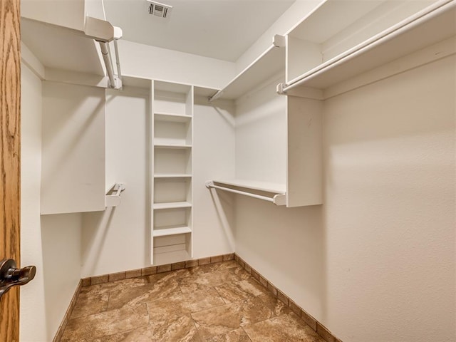 3501 Shell Ln, Yukon, OK 73099 - spacious closet featuring stone finish flooring