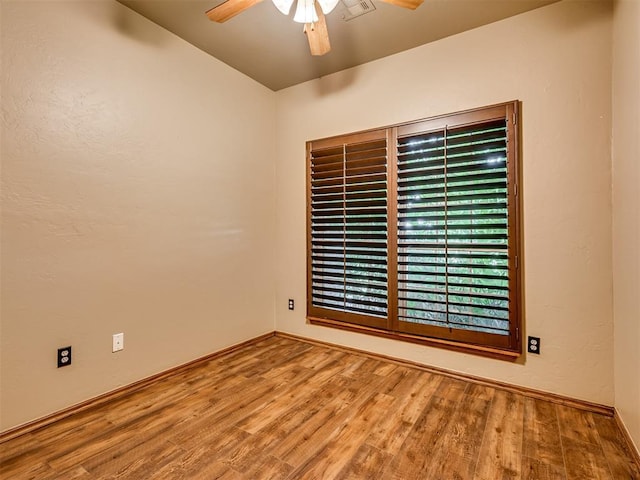 3501 Shell Ln, Yukon, OK 73099 - spare room with a ceiling fan, wood finished floors, and baseboards