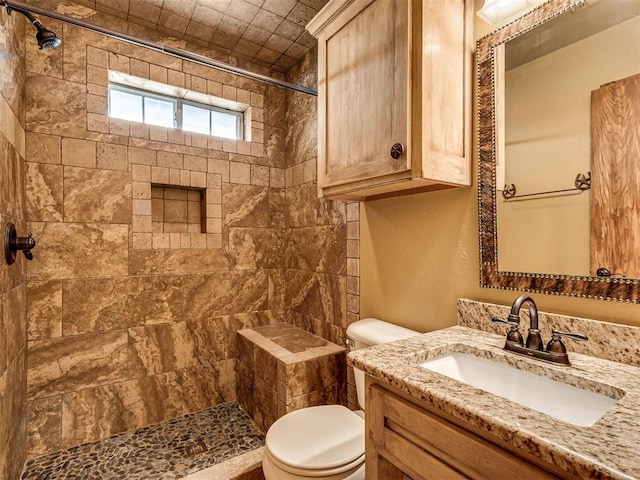 3501 Shell Ln, Yukon, OK 73099 - full bathroom with tiled shower, vanity, and toilet