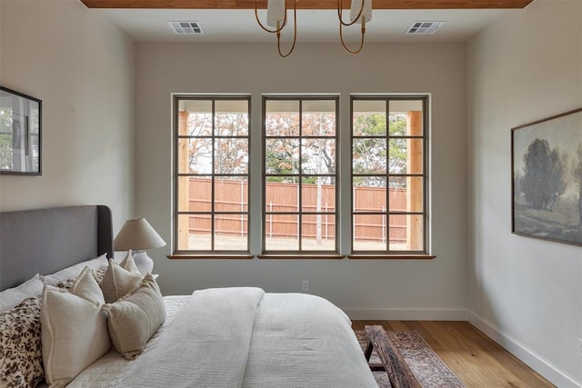 2917 Kite Tail Xing, Edmond, OK 73034 - bedroom featuring light wood-style floors and baseboards