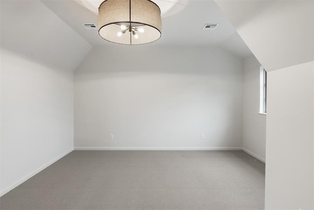 2917 Kite Tail Xing, Edmond, OK 73034 - additional living space with vaulted ceiling, carpet flooring, and baseboards