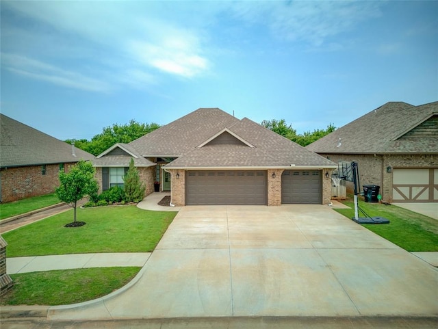 2613 Ethan Ln, Oklahoma City, OK 73160 - view of front facade featuring brick siding, an attached garage, roof with shingles, and a front lawn