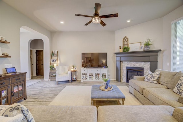 2613 Ethan Ln, Oklahoma City, OK 73160 - living room with ceiling fan, wood finished floors, arched walkways, a fireplace, and recessed lighting