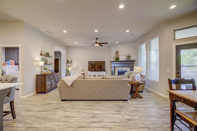 2613 Ethan Ln, Oklahoma City, OK 73160 - living room with baseboards, arched walkways, recessed lighting, a fireplace, and ceiling fan