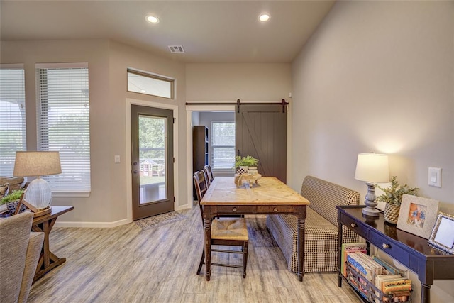 2613 Ethan Ln, Oklahoma City, OK 73160 - dining room featuring baseboards, light wood-style floors, recessed lighting, and a barn door