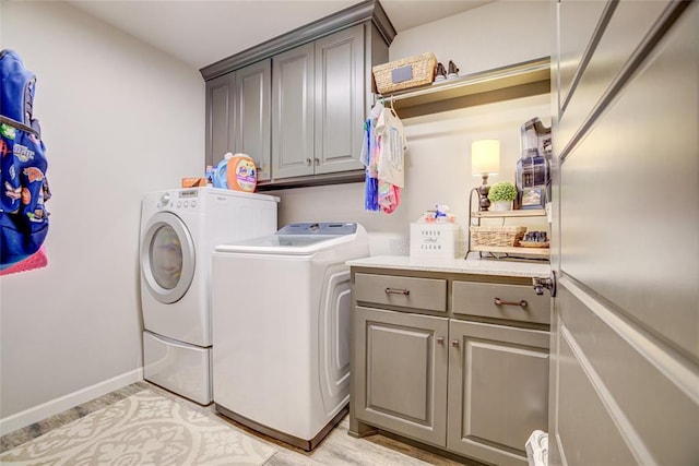 2613 Ethan Ln, Oklahoma City, OK 73160 - washroom with cabinet space, washing machine and dryer, and baseboards