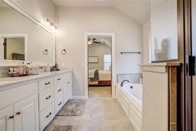 2613 Ethan Ln, Oklahoma City, OK 73160 - ensuite bathroom featuring lofted ceiling, double vanity, ceiling fan, and a bath