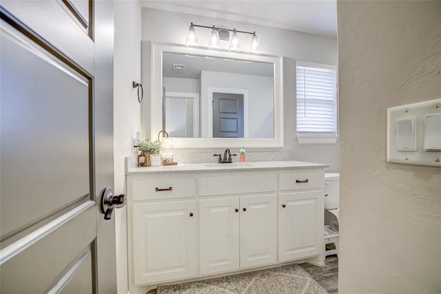 2613 Ethan Ln, Oklahoma City, OK 73160 - bathroom featuring vanity and toilet
