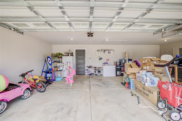 2613 Ethan Ln, Oklahoma City, OK 73160 - garage featuring a garage door opener