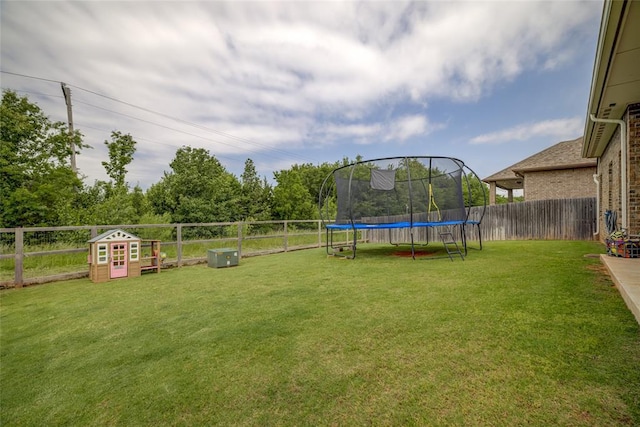 2613 Ethan Ln, Oklahoma City, OK 73160 - view of yard featuring a trampoline
