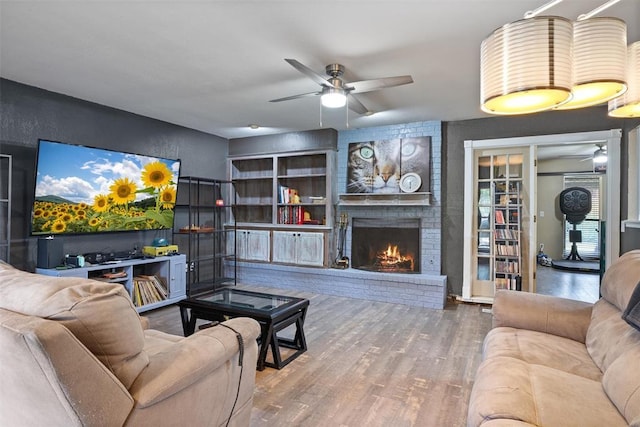 9703 Woodrock Ct, Oklahoma City, OK 73130 - living room with a ceiling fan, a fireplace, and wood finished floors