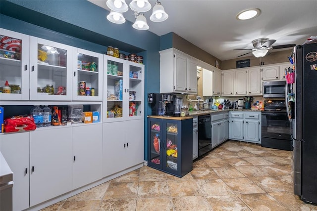 9703 Woodrock Ct, Oklahoma City, OK 73130 - kitchen with black appliances, a chandelier, white cabinets, ceiling fan, and light stone finish flooring