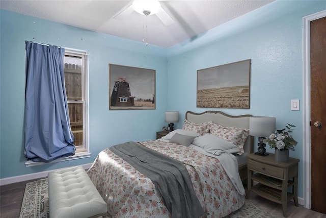9703 Woodrock Ct, Oklahoma City, OK 73130 - bedroom with wood finished floors and ceiling fan