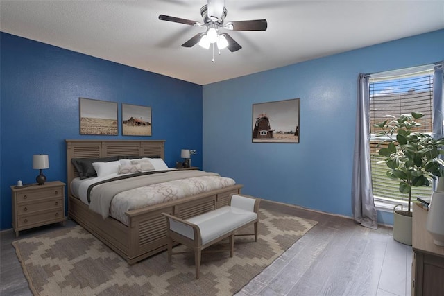 9703 Woodrock Ct, Oklahoma City, OK 73130 - bedroom with wood finished floors and ceiling fan