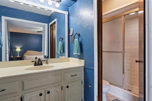 9703 Woodrock Ct, Oklahoma City, OK 73130 - ensuite bathroom featuring a shower stall, vanity, and tile patterned flooring