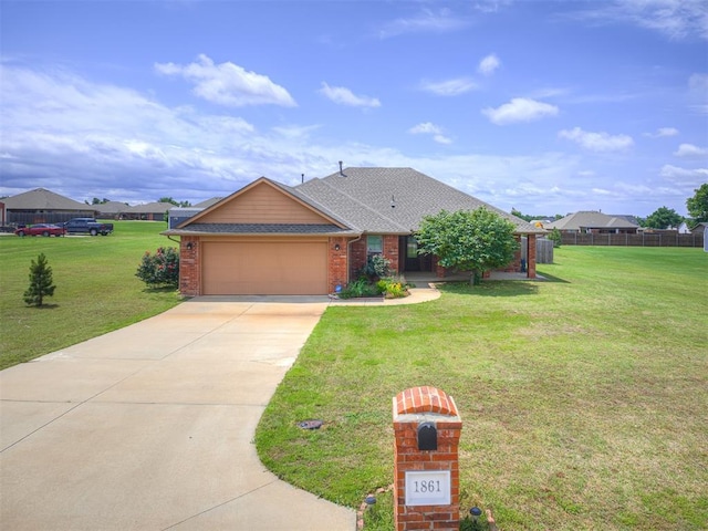 1861 Debbie Dr, Guthrie, OK 73044 - view of front of property featuring an attached garage, driveway, brick siding, and roof with shingles